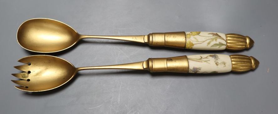 A late Victorian Royal Worcester ivory porcelain salad bowl and servers, with gilt metal mounts, date code 1892, bowl 24cm diameter
